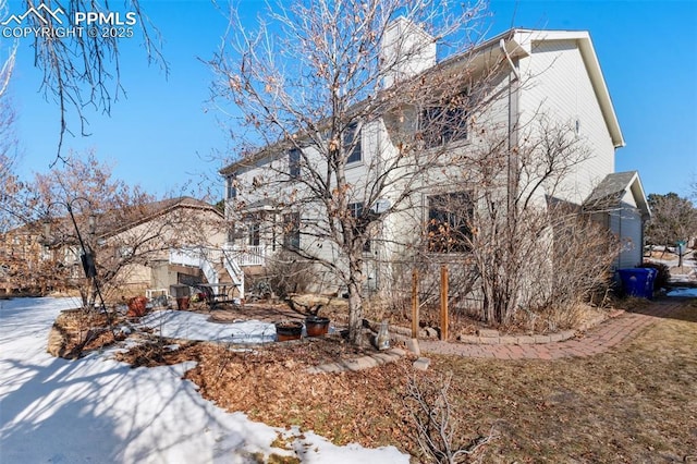 view of snow covered property