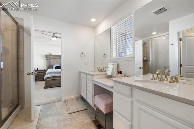 ensuite bathroom with visible vents, connected bathroom, vanity, a shower stall, and recessed lighting