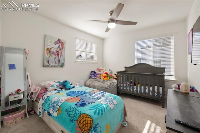 bedroom with carpet and a ceiling fan