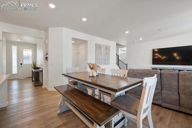 dining space featuring light wood-type flooring, baseboards, and recessed lighting