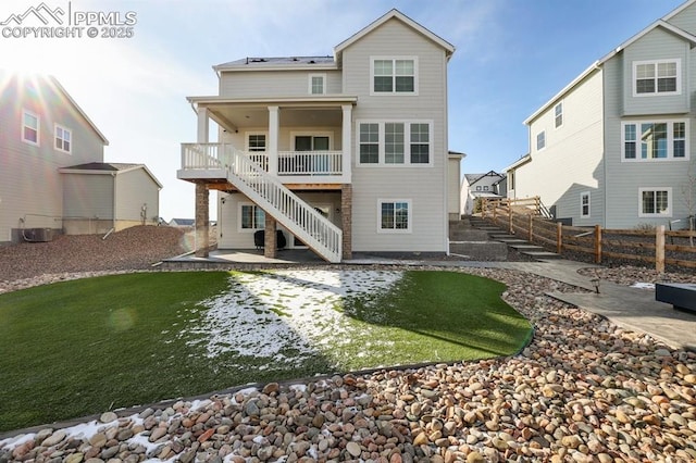 back of house featuring a patio, stairway, and a fenced backyard