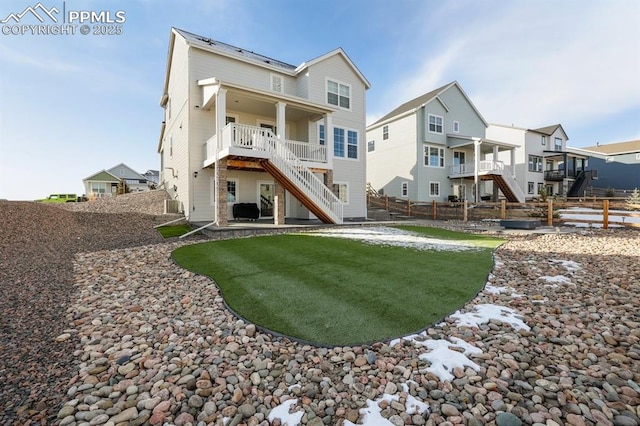 rear view of house with a residential view, stairs, fence, and a patio