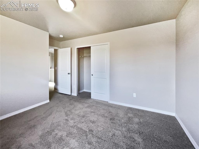 unfurnished bedroom with carpet and a closet