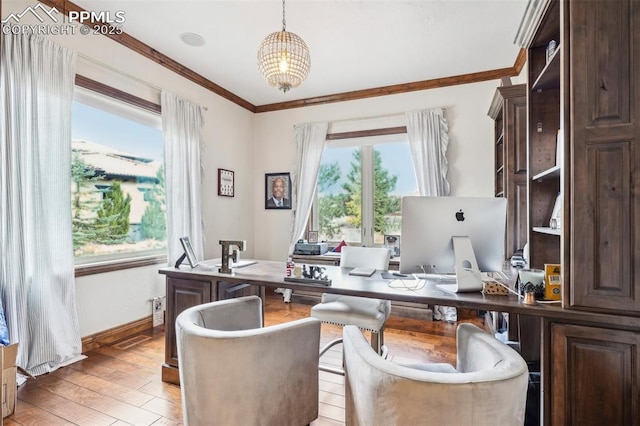 office space featuring an inviting chandelier, ornamental molding, and light hardwood / wood-style floors