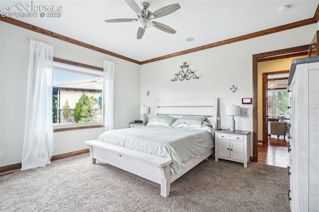 bedroom featuring ceiling fan, carpet, and crown molding