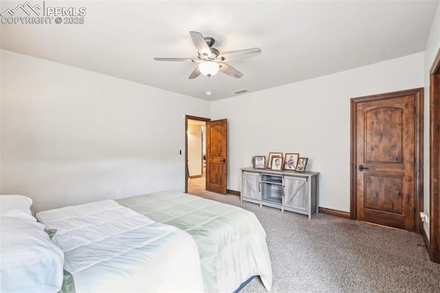 bedroom featuring ceiling fan and carpet