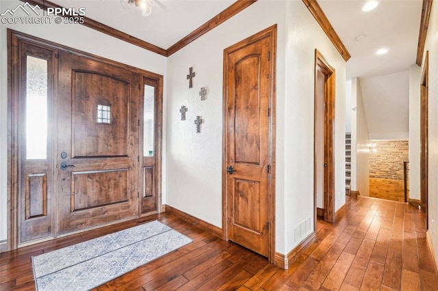 entryway featuring dark hardwood / wood-style flooring and crown molding