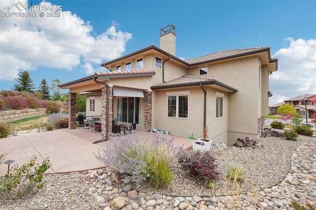 rear view of house with a patio area