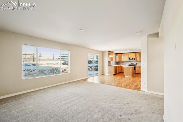 unfurnished living room with light carpet