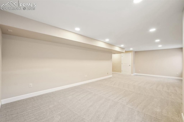 basement featuring light colored carpet