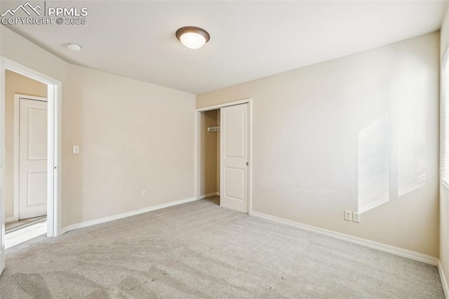 unfurnished bedroom featuring light colored carpet