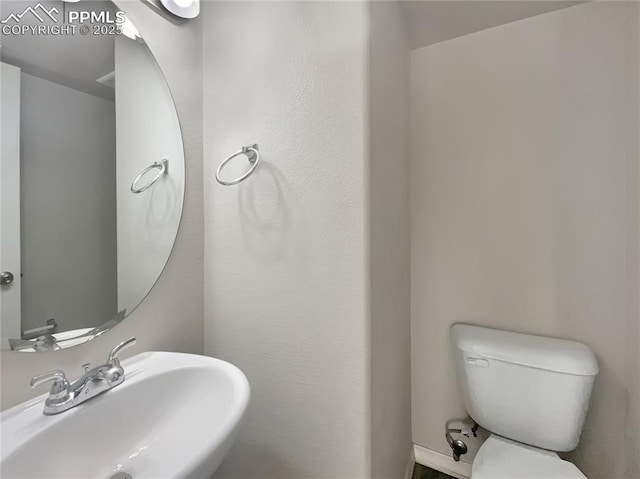 bathroom with sink and toilet