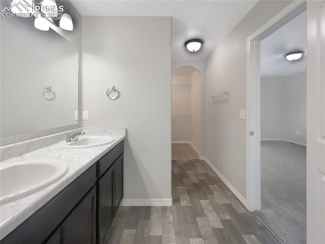 bathroom featuring hardwood / wood-style flooring and vanity