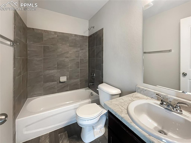 full bathroom with vanity, toilet, wood-type flooring, and tiled shower / bath combo