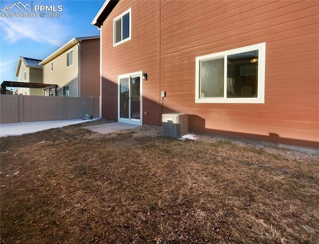 rear view of property with central air condition unit