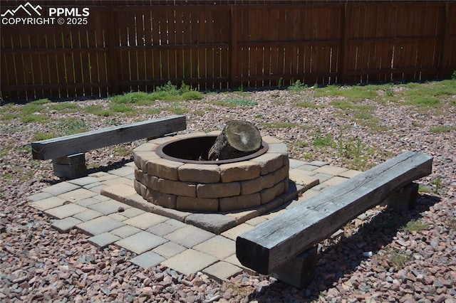 view of patio with an outdoor fire pit