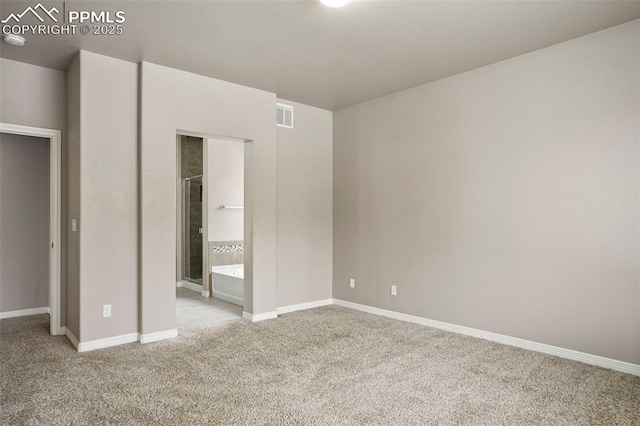 unfurnished bedroom featuring connected bathroom and light colored carpet