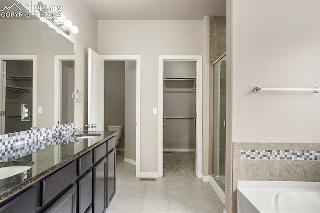 bathroom with tile patterned flooring, vanity, and independent shower and bath