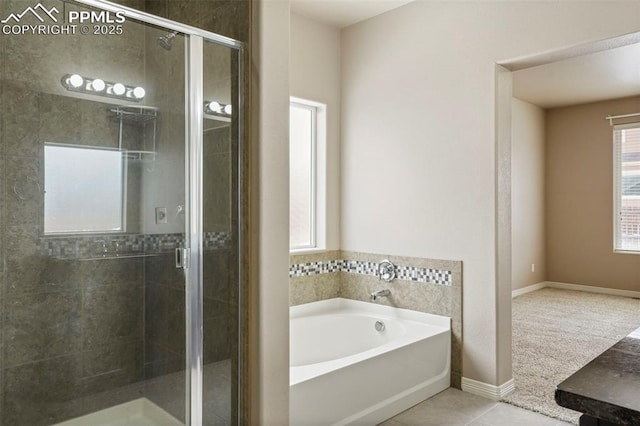 bathroom with tile patterned flooring, vanity, and separate shower and tub