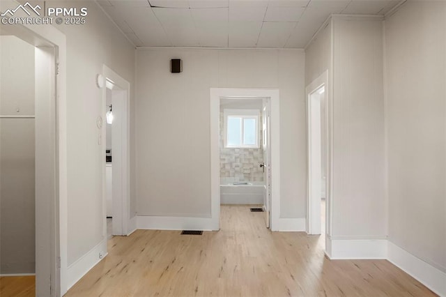 hallway featuring light wood-type flooring