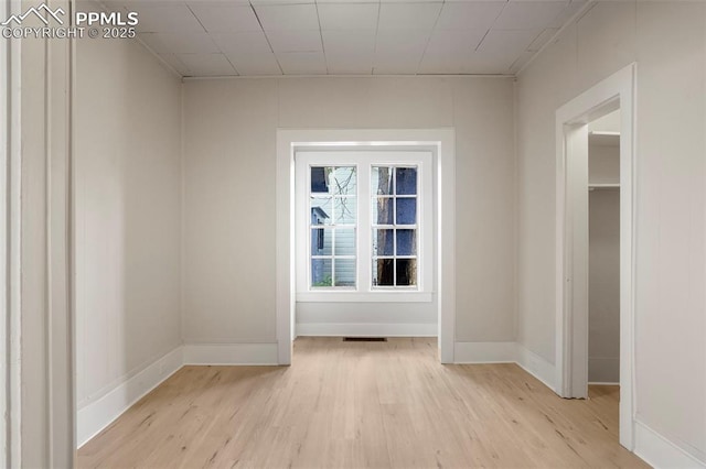 unfurnished room with light hardwood / wood-style floors