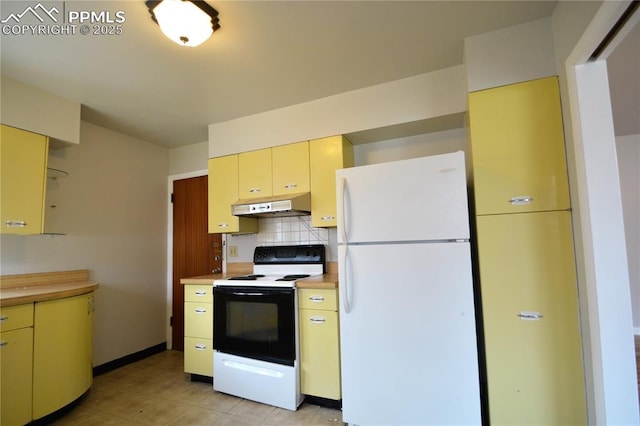 kitchen with white refrigerator, range with electric stovetop, and tasteful backsplash