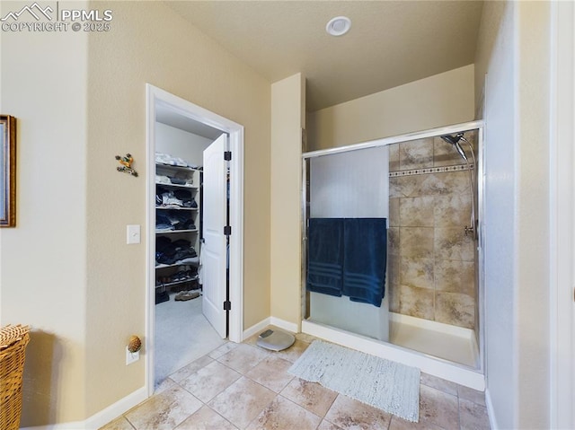 bathroom with a shower with shower door