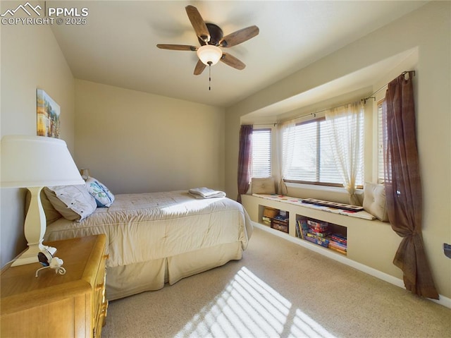 bedroom featuring ceiling fan and carpet