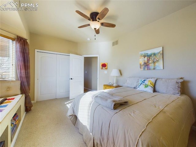 bedroom featuring ceiling fan and a closet