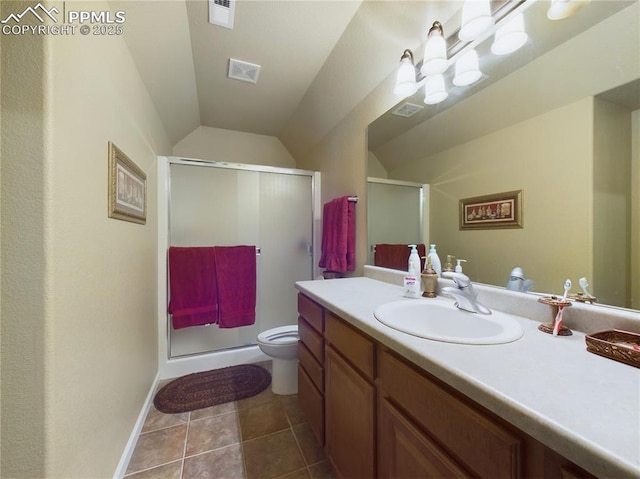 bathroom with walk in shower, vanity, vaulted ceiling, toilet, and tile patterned flooring