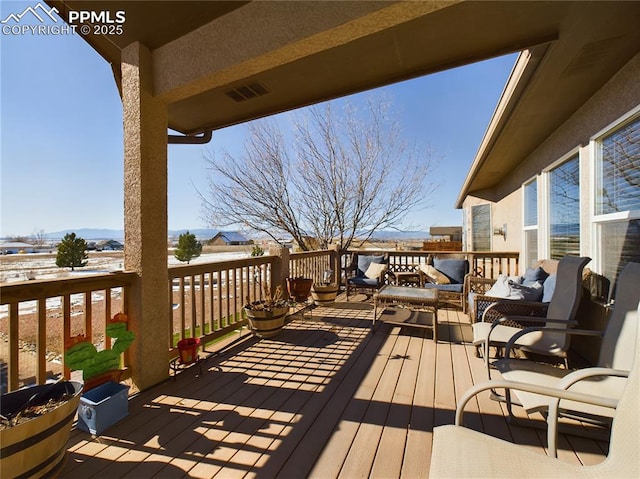 deck with an outdoor living space