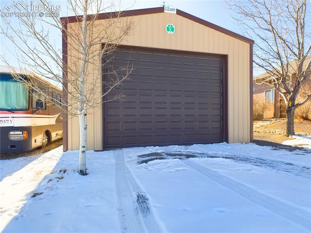 view of snow covered garage