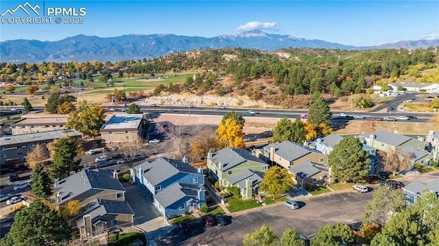 birds eye view of property featuring a mountain view