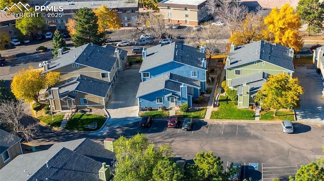 birds eye view of property with a residential view