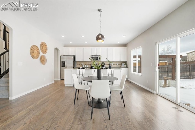 dining space featuring light hardwood / wood-style flooring