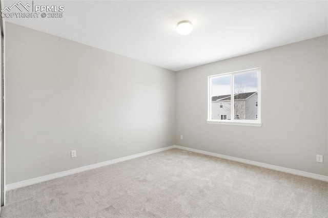 unfurnished room with light carpet