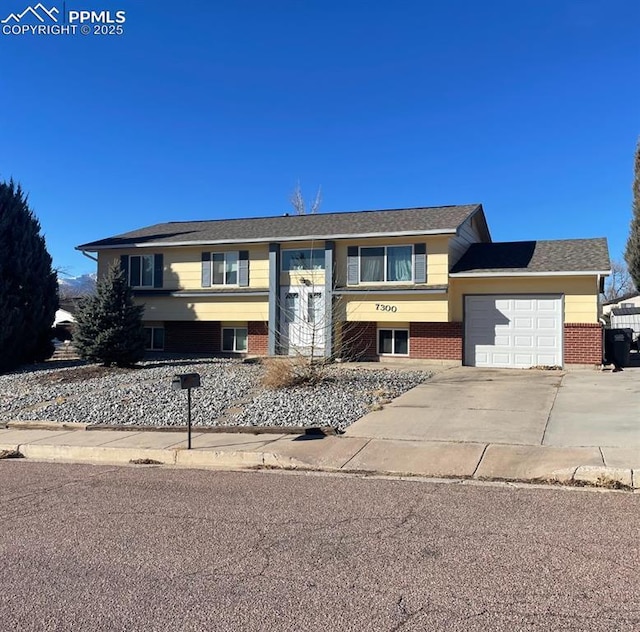 split foyer home featuring a garage