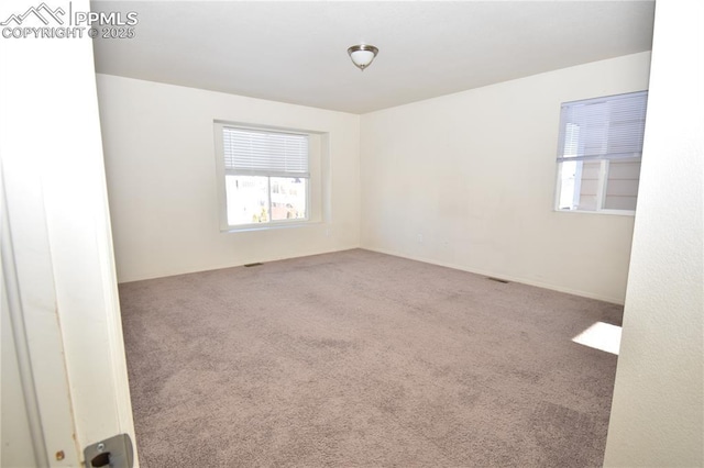 view of carpeted spare room