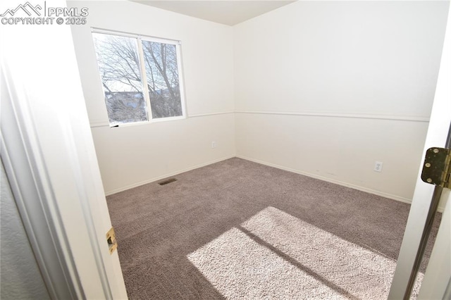 spare room with carpet flooring