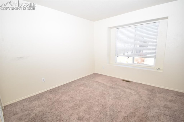 spare room with light carpet