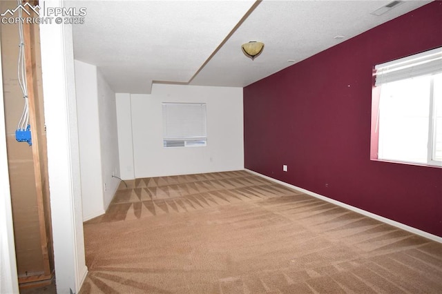 additional living space with light colored carpet