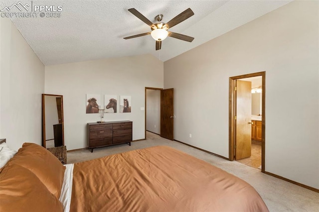 bedroom featuring a textured ceiling, lofted ceiling, connected bathroom, ceiling fan, and light colored carpet