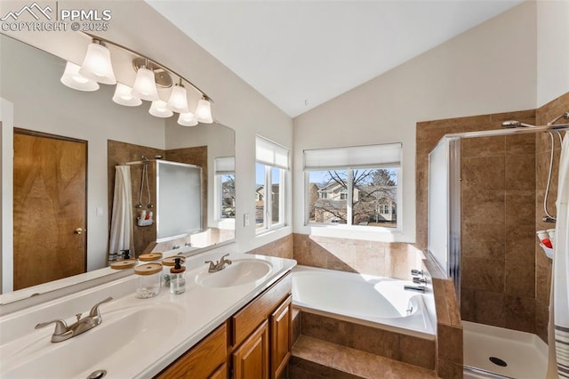 bathroom with lofted ceiling, vanity, and plus walk in shower