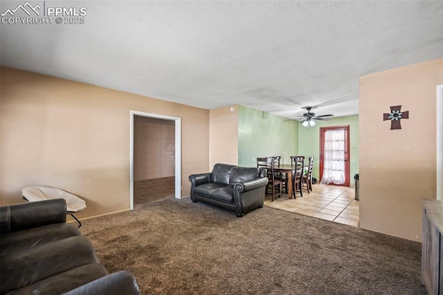 living room featuring ceiling fan and light colored carpet