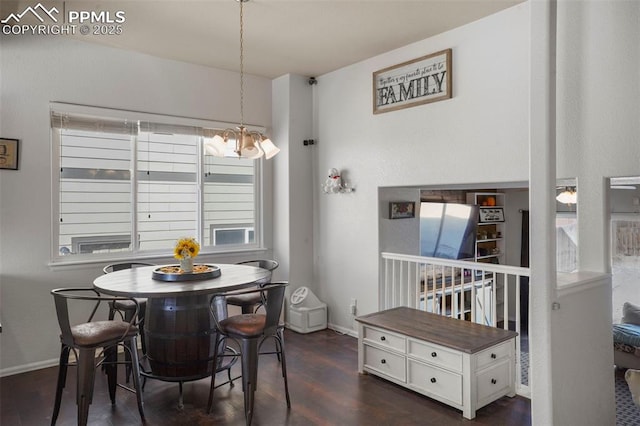 dining area with dark wood-type flooring and a chandelier