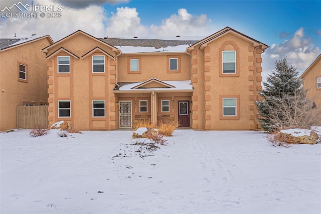 view of snow covered house