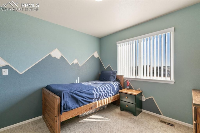 carpeted bedroom featuring visible vents and baseboards