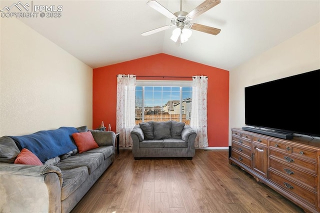 living room featuring a ceiling fan, vaulted ceiling, and wood finished floors