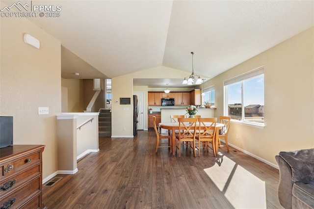 dining area with lofted ceiling, dark wood finished floors, stairway, and baseboards