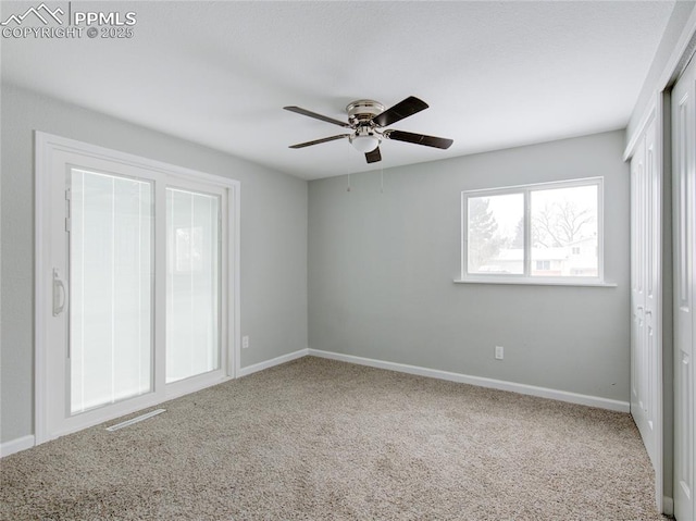 unfurnished bedroom featuring carpet flooring and ceiling fan